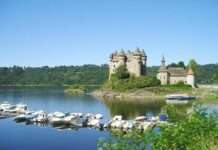 Kultur, Krater, kleine Dörfer: Warum das Cantal mehr ist als nur grüne Hügel Lac de Bort-les-Orgues und château de Val (Wikipedia)
